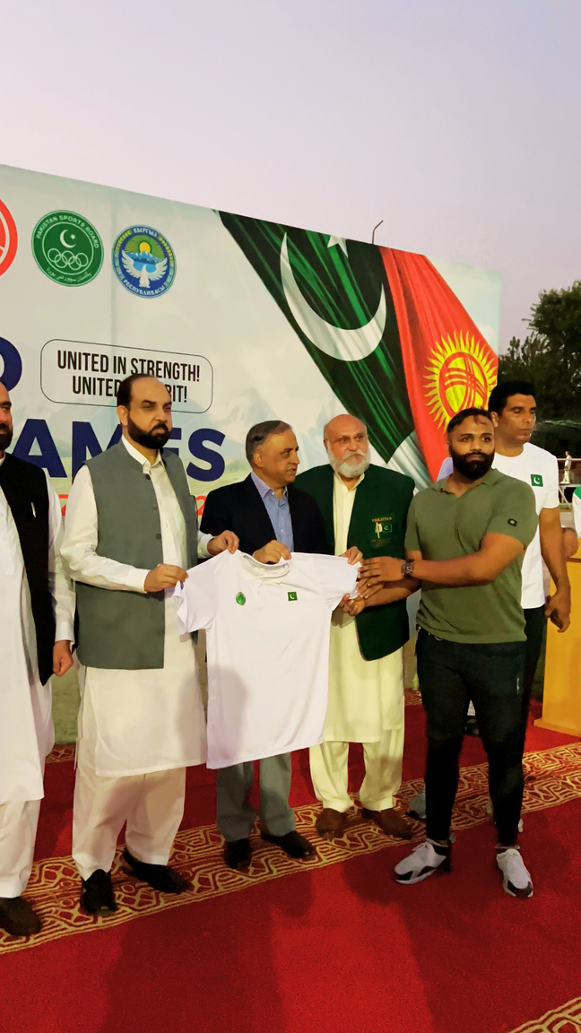 Pakistan Sports Board officials distributing kits to athletes
