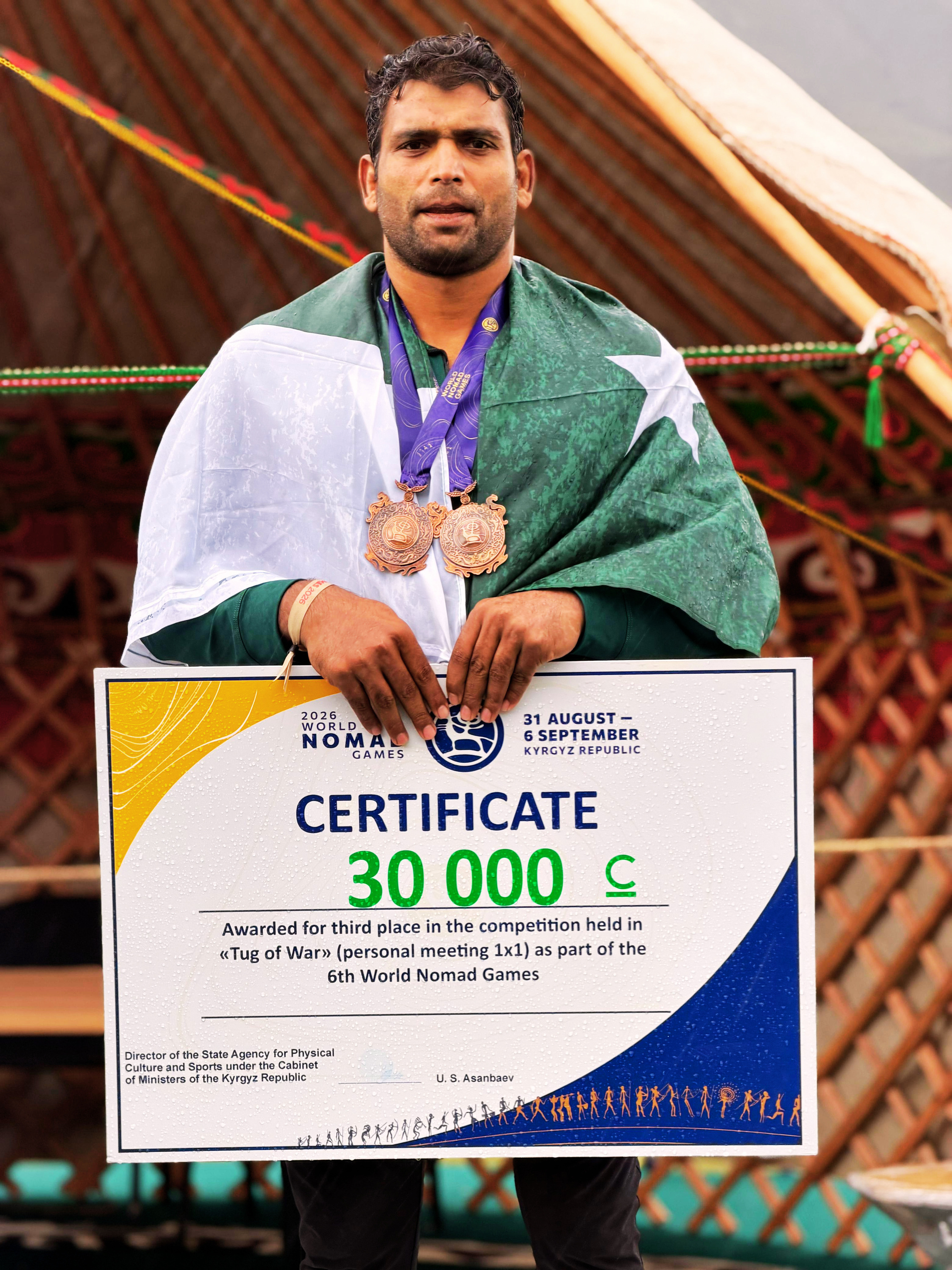 Tayyab Raza Awan with his bronze medals and certificate